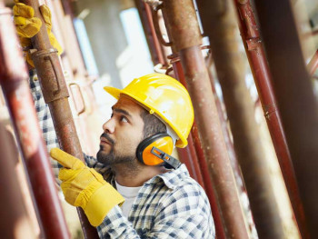 Construction worker wearing ear protection