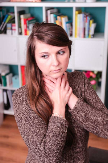 Young woman with hoarseness