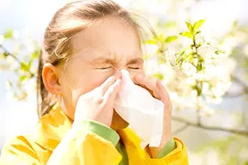 Girl sneezing who needs allergy testing and allergy care at CEENTA