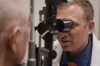 Man receiving testing for early glaucoma detection with Dr. Chamberlain