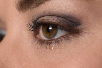 A woman cries.