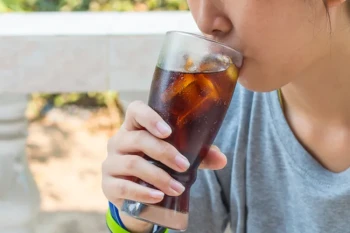 Woman enjoying soda and avoiding drink coming out of nose and velopharyngeal insufficiency