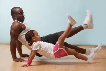 Father and daughter exercising for better eye health