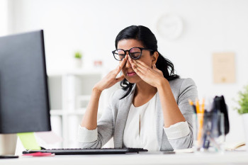 A woman with pressure behind her eye