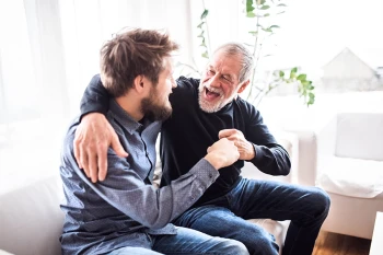 A father with hearing loss has a good conversation with his son