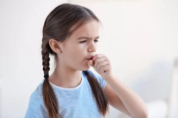 A young coughing girl