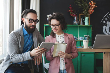 A couple wearing glasses watches CEENTA's Five on Friday