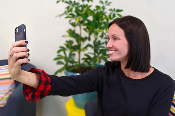 Showing the "good side" during a selfie.