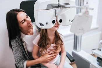 A child gets an eye exam after failing a vision screening.