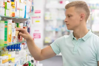 A man buys medicine for his allergies