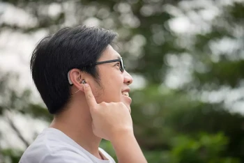 A man with glasses and hearing aids