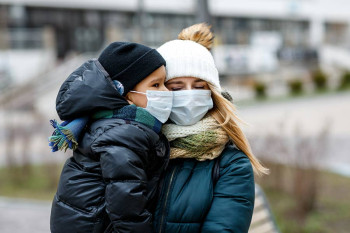 A family wearing their masks.
