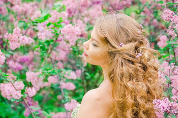 A woman uses her sense of smell after a nose job