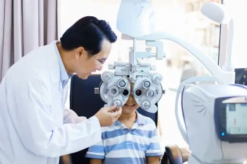 Pediatric eye doctor examining common pediatric eye conditions