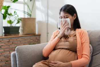 Woman who is pregnant and wondering "Does pregnancy affect allergies?"