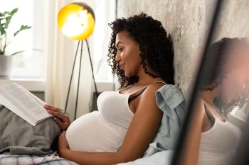 A pregnant woman reads about gestational diabetes.