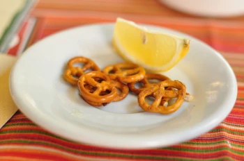 Lemons and pretzels are two of many foods to avoid with a sore throat