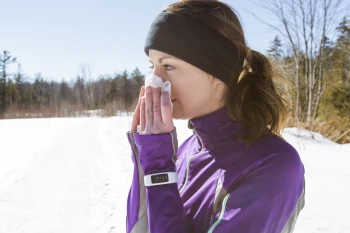 A woman gets a runny nose while running