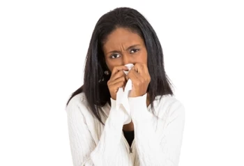 A woman with a nosebleed learns how to treat nosebleeds