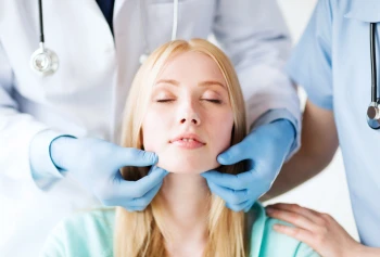 A woman at a facial plastic surgery consultation.