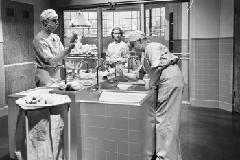 Doctors in history prepare for surgery.