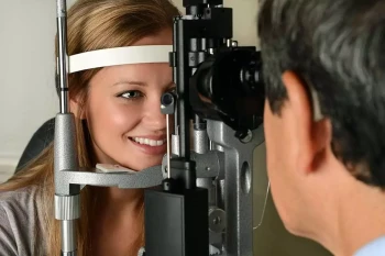 A woman gets an eye exam to get her vision tested and to screen for glaucoma and cataracts