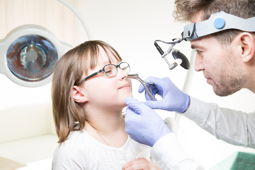 Rhinologist examining patient for chronic sinusitis