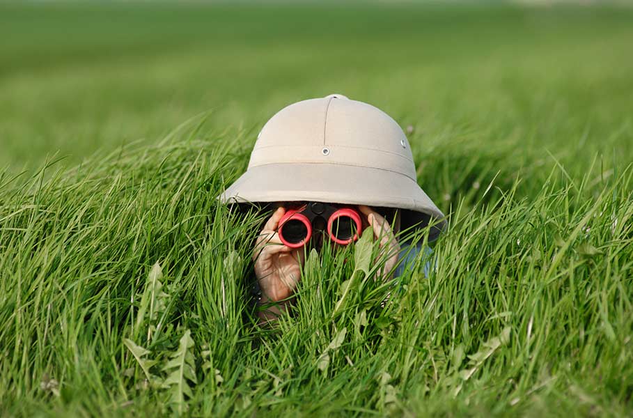 A child plays with binoculars