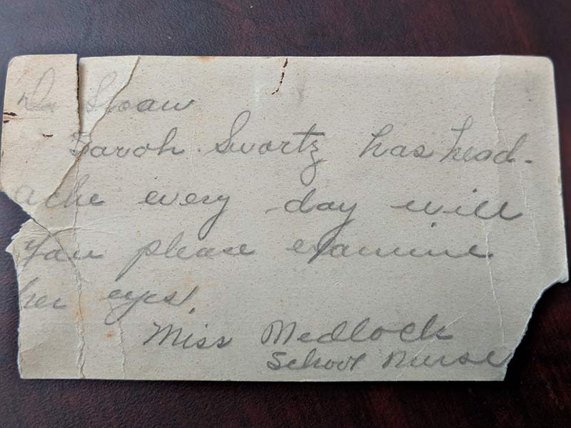 An old business card with patient care requests