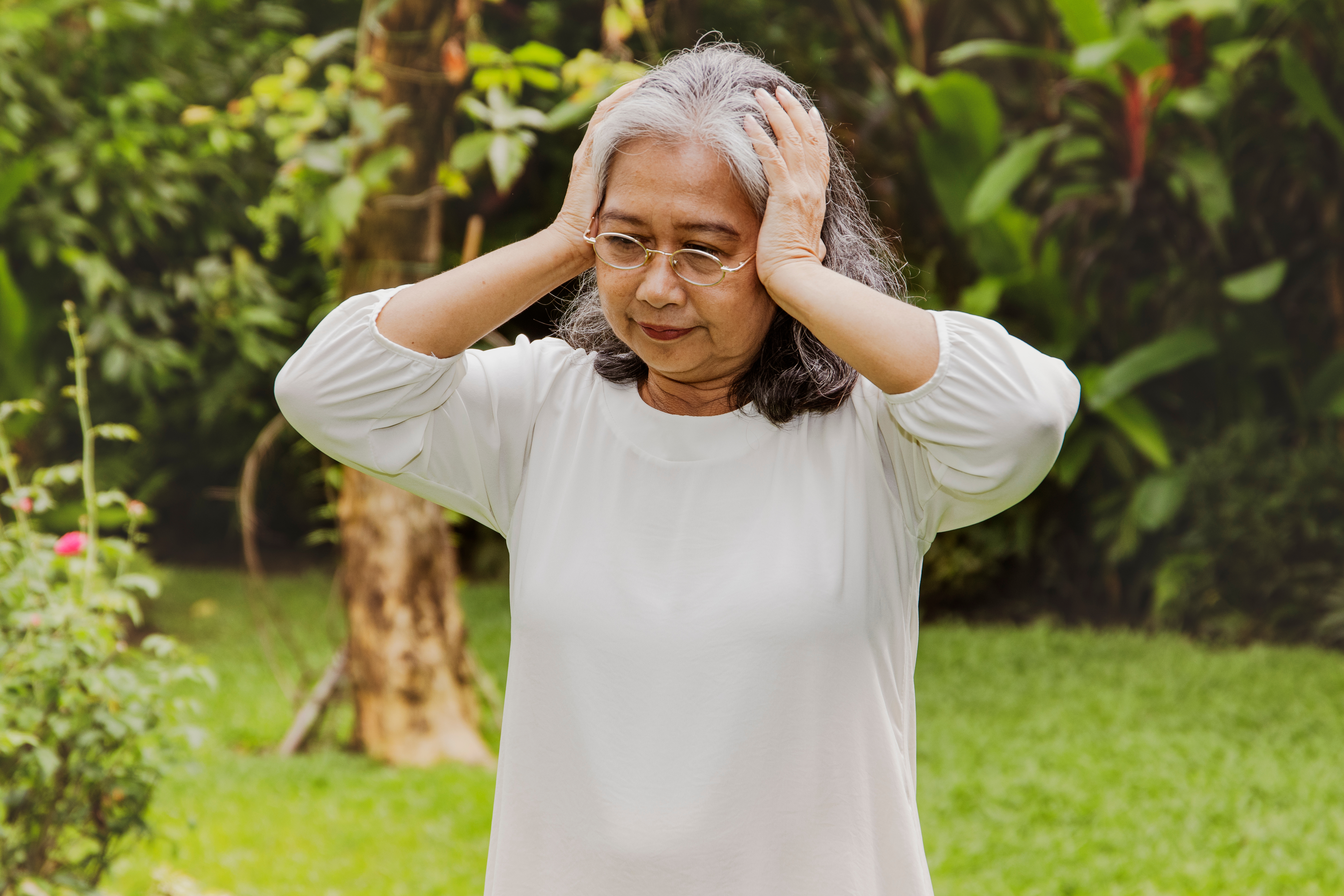 A woman with tinnitus/ringing in ears